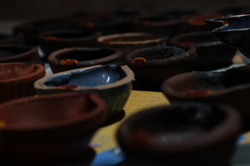 Artistic homemade clay oil lamps or karthikai deepam are ready for diwali and karthikai festivals