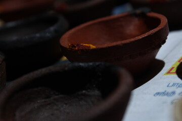 Artistic homemade clay oil lamps or karthikai deepam are ready for diwali and karthikai festivals