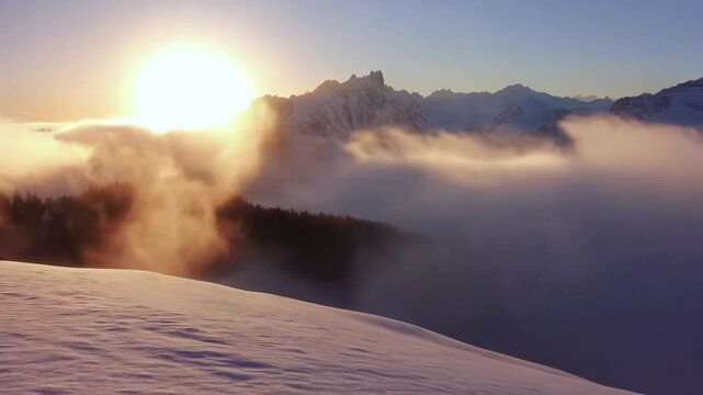 Panoramic view to summit and snow peaks with beautiful sunlight. Scenery view down on snow covered valley.
