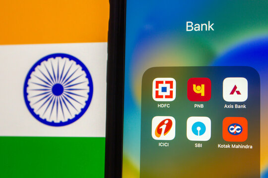 Vancouver, CANADA - Sep 9 2024 : HDFC, PNB, Axis Bank, ICIC, SBI and Kotak Mahindra icons are displayed on an iPhone screen with Indian Flag background. Indian bank concept image.