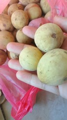 Raw Pasir Banana is ready to be fried and a large sweet and beautiful duku fruit