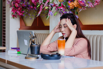 expression of beautiful young asian woman close eyes both hands hold head hurts, headache pain...