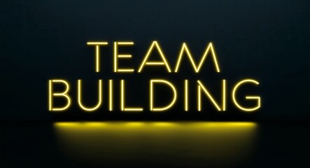 team building word lettering with yellow glow on plain black dark background