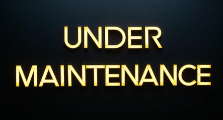 under maintenance word lettering with yellow glow on plain black dark background