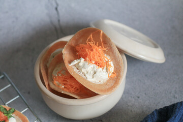 Thai crispy pancakes topped with strips of egg yolks. Very famous authentic Thai snack. Vegetarian diet. Vegan dessert.