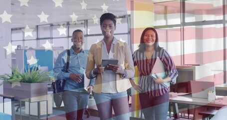 Image of flag of usa over happy diverse businesspeople in office