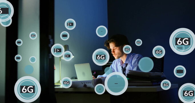 Image of circles with 6g over caucasian businessman using laptop in office - Powered by Adobe