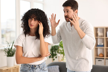 Emotional couple having quarrel at home. Relationship problems