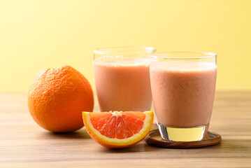 Orange yogurt smoothies in glass, Healthy fruit drink