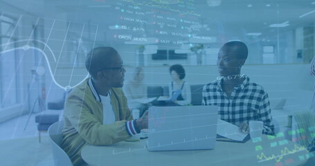 Image of financial data processing over diverse colleagues discussing work in office