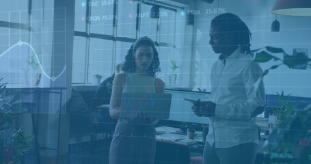 Image of financial data processing over diverse colleagues discussing work in office