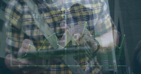 Image of financial data processing over caucasian man using tablet in city