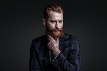 Brutal bearded man isolated on grey. Ambitious man in elegant suit menswear. Formal fashion for man. Suit on menswear model. Stylish man in business suit. Businessman with beard. Eveningwear ensemble