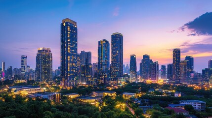 Fototapeta premium A skyline view during blue hour, with twinkling lights illuminating modern skyscrapers against a darkening sky.