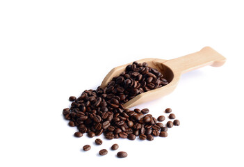 Fresh coffee beans in a wooden spoon.