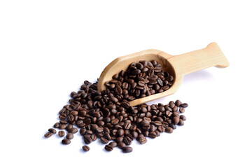 Fresh coffee beans in a wooden spoon.