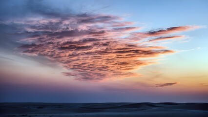 Fototapeta premium Desert sunset sky with glowing cirrostratus clouds