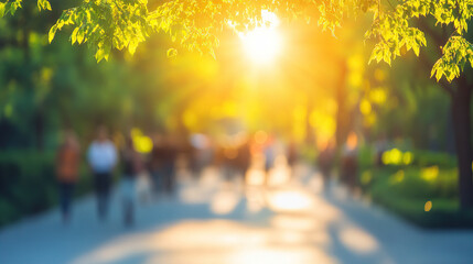 Blurred city street with people walking in the sunlight