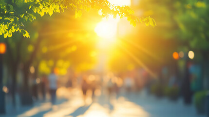 Blurred city street with people walking in the sunlight