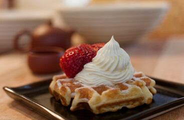 Waffle with strawberry and cream