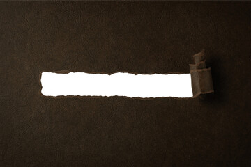 引き裂かれ、めくれた茶色い紙の背景フレーム