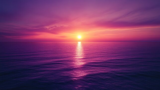A purple sunset over the ocean, casting a warm glow over the water and sky, creating a serene atmosphere.