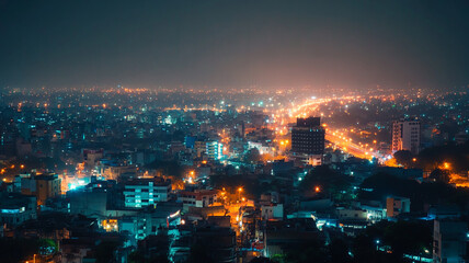 Obraz premium Nighttime cityscape showing a vibrant urban skyline with illuminated buildings and streets