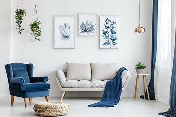 Interior of modern living room with blue armchair, sofa and plants