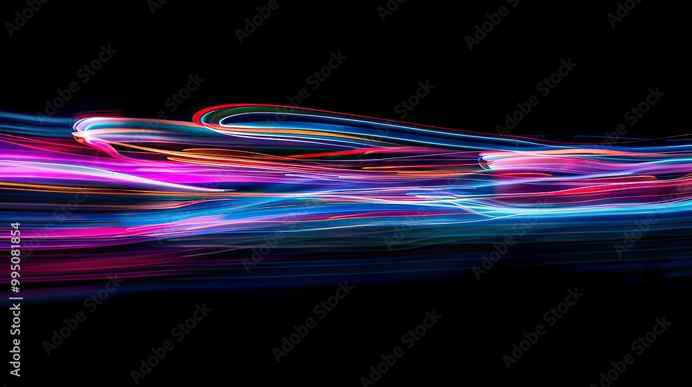 Poster capture vibrant streaks of light in a dark environment, simulating high-speed movement.