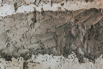 Gray textured concrete background. Close-up wall with textured paint strokes