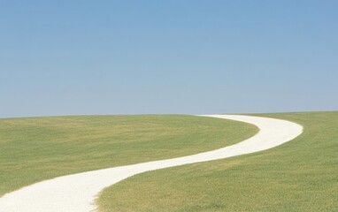 Naklejka premium Serene Winding Path through Lush Green Field under Clear Blue Sky
