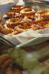 Fresh baked Pastel de nata or Pastel de belém .The most famous sweet in Portugal. Tart on baking sheet/