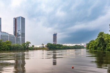 Moskva River and urban architecture of the capital downtown on a summer day