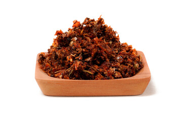 Chili oil sambal made from dried bird’s eye chilies, garlic, spices, herbs, kaffir lime leaves, and oil, photographed on a white background. A perfect companion for adding bold, delicious heat to any 