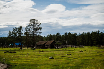 dilapidated houses in the village of Multa in Altai during sunset