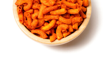 A bowl of crispy, deep-fried macaroni snack coated in spicy red seasoning. Crunchy, savory, and perfect for anytime snacking. Photographed on a white background.