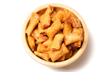 A bowl of Sumpia, Indonesian traditional mini spring rolls filled with shrimp floss. The crunchy outer wrapper is deep-fried to perfection. Photographed on a white background.