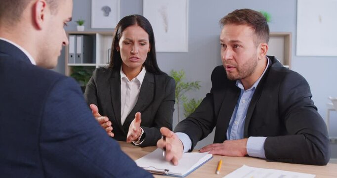 Dissatisfied client and manager having conflict in office, dishonest business, employee bad financial report mistake, aggressive man claims complaint disputing bad contract terms meeting lawyer, fraud