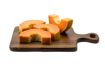 Group of sliced ripe papaya in wooden cutting board isolated on white background stack with clipping path closed up.