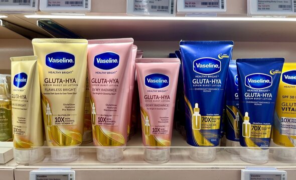 Jakarta, Indonesia - September 12th, 2024 - Vaseline healthy bright gluta-hya serum body lotion skin care product in Sociolla store shelf display isolated on horizontal background.