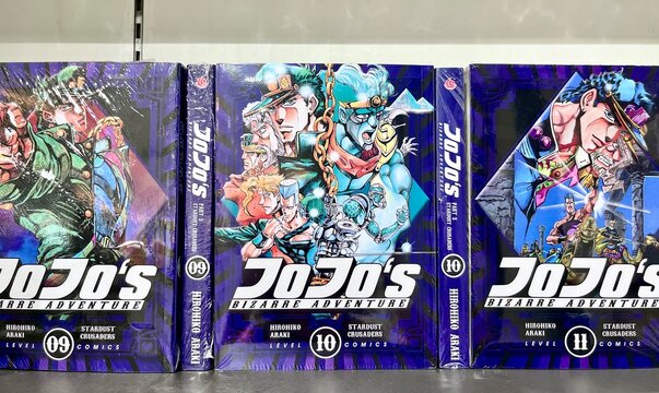 Jakarta, Indonesia - September 12th, 2024 - Jojo Bizzare Adventure volume 9, 10, and 11 manga comic book isolated on horizontal ratio Gramedia store shelf background.