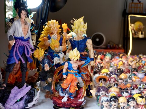 Jakarta, Indonesia - September 19th, 2024 - Sasuke, Goku, Kageyama, Kenma, Tanjiro, and other anime characters toy figures isolated on horizontal ratio indoor environment background.