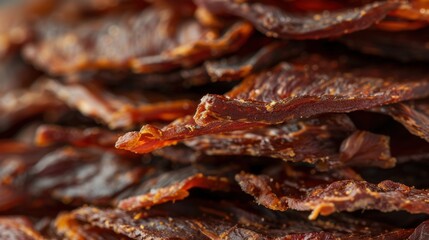 Jerky: Savory strips of dried meat, primarily beef, packed with protein and seasoned in delicious flavors like teriyaki or barbecue for a tasty snack.
