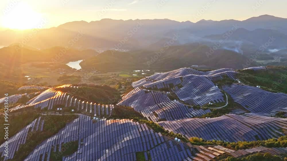 Wall mural Aerial photography of solar photovoltaic panels，sunset over the mountains