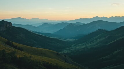 Fototapeta premium A sweeping view of a mountain range during sunrise