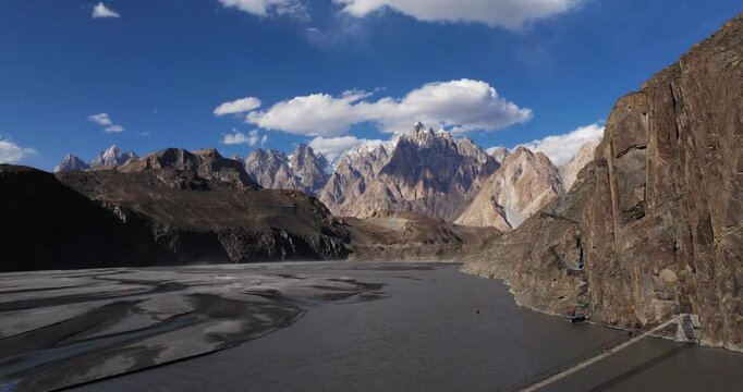 Drone Shot Above Hussaini Suspension Bridge, Zipline. Hunza Valley, Pakistan. Passu Cones Mountains in Background. Summer Day