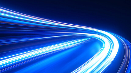 A dynamic image featuring bright blue light trails against a dark backdrop.