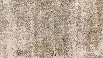 Close-up texture of an aged, weathered wall with natural stains and rough surface, ideal for backgrounds or design elements.