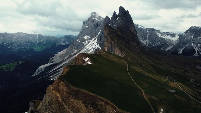 4k Aerial Drone View Flying Straight Torward The Sloping Ridgeline And Peaks Of Seceda In Val Gardena, Dolomites In Northern Italy
