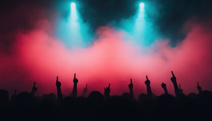 Fototapeta premium Silhouettes of Concert Crowd with Raised Hands Under Stage Lights